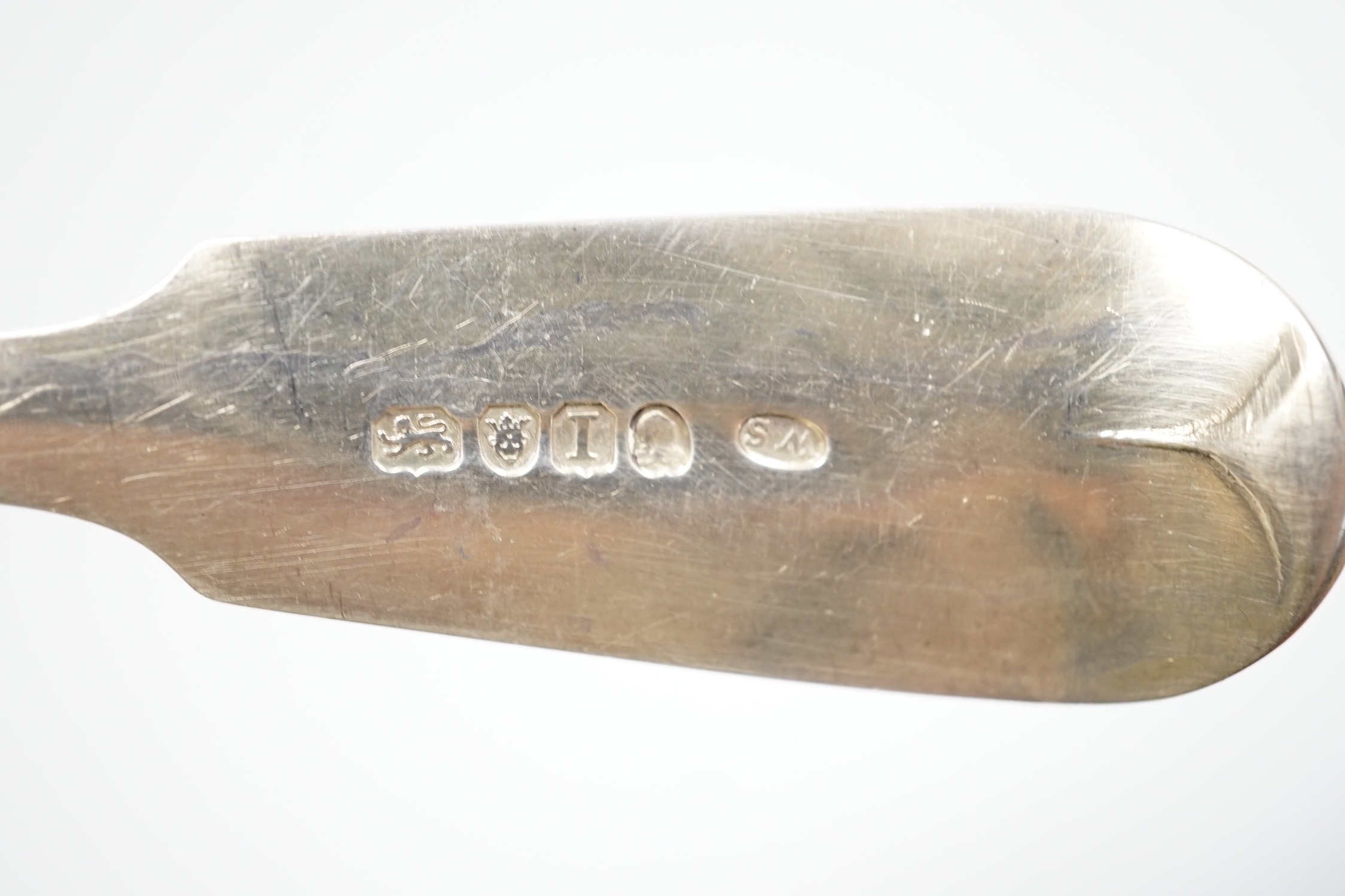 A George III silver fiddle pattern basting spoon, London, 1804 and seven other items of mainly 19th century silver flatware, 18.6oz.